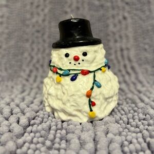 White Snowman Holiday Candle with Black Top Hat and Multicolor Lights